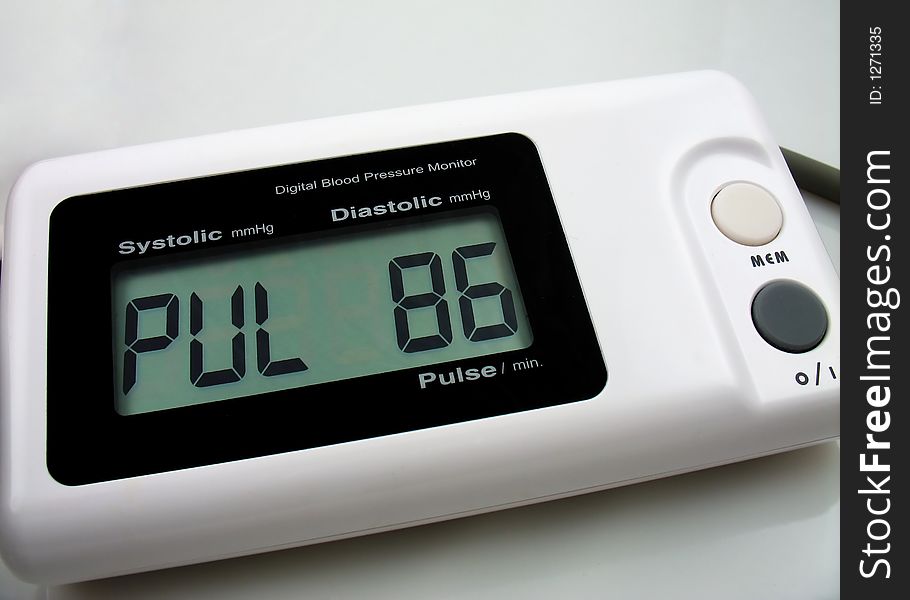 Pulse. Digital blood preasure monitor isolated, macro