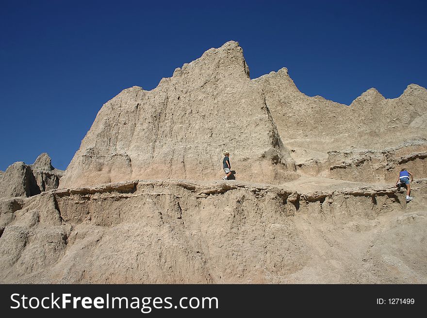Two children hiking in the badlands