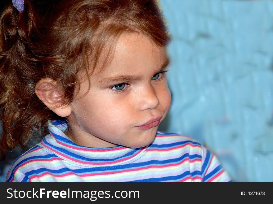 A young girl with big blue eyes and pigtails. A young girl with big blue eyes and pigtails.