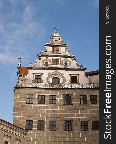 The image shows an old,historic house facade in the city of Neuburg (Germany, Bavaria). In the background is a blue sky. The image shows an old,historic house facade in the city of Neuburg (Germany, Bavaria). In the background is a blue sky.