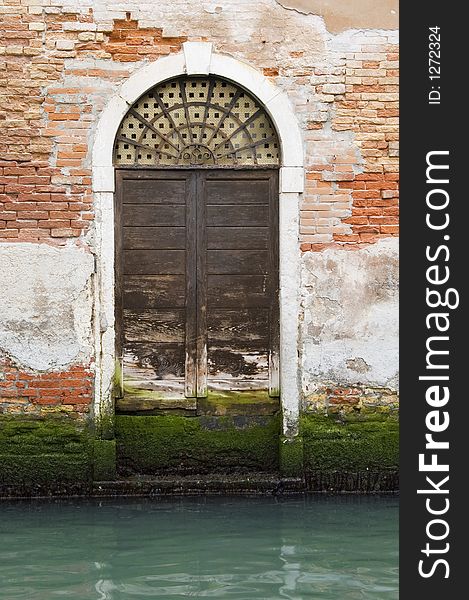 A view of a laguna-touched door in Venice, Italy. A view of a laguna-touched door in Venice, Italy