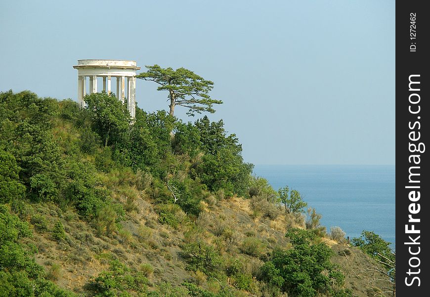 Arbor and tree on slope