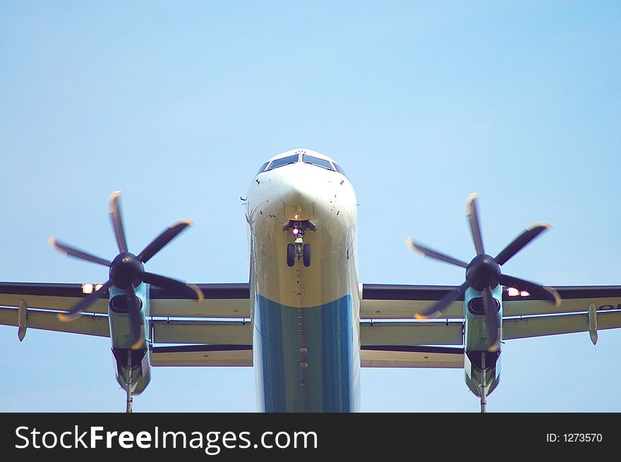 Landing plane, front on a blue sky. Landing plane, front on a blue sky