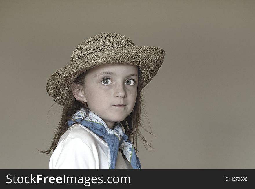 Little Girl Wearing Straw Hat