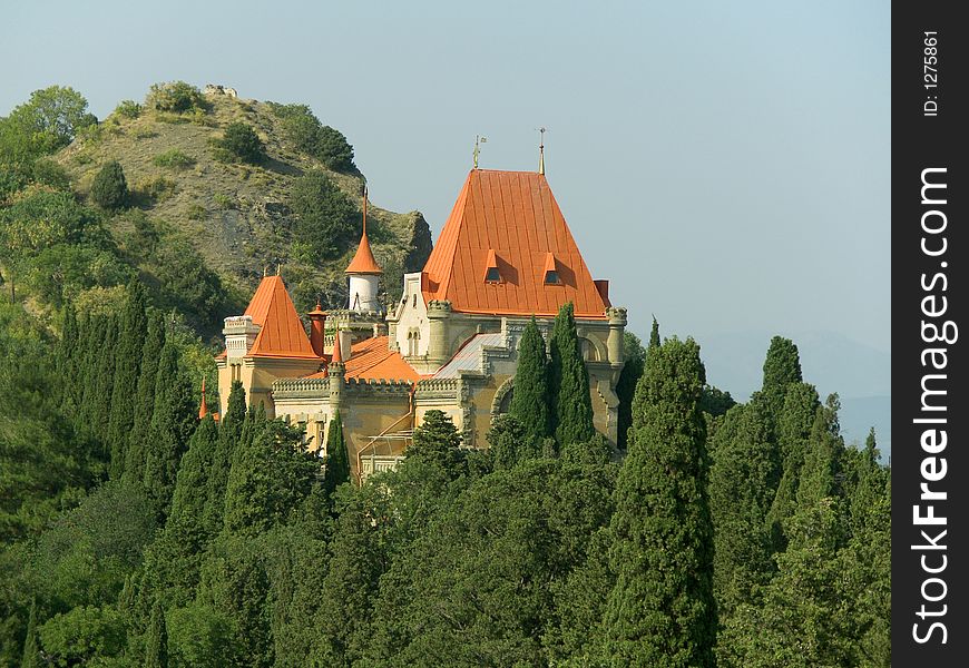 Castle in forest on slope