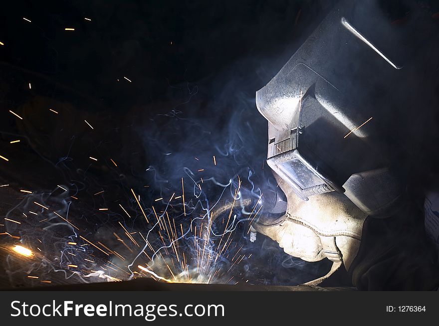 Arc welder in action at night. Arc welder in action at night