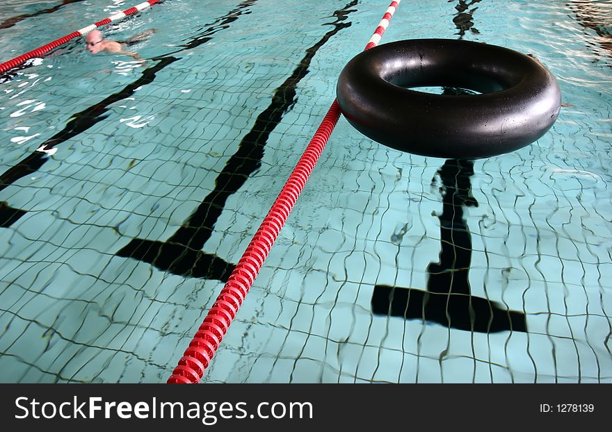 Indoor swimming pool fun, a big black buoy