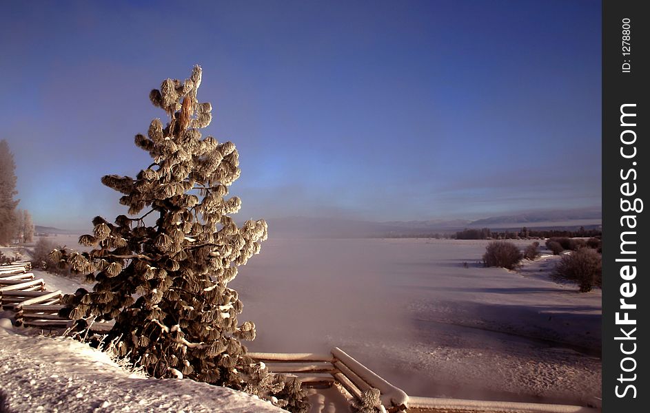 Steam rises from hot springs on 20 degrees below zero morning in wesr central Idaho