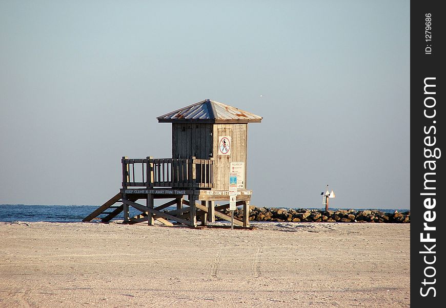 This lifeguard tower stands ready by the edge of the ocean. This lifeguard tower stands ready by the edge of the ocean.