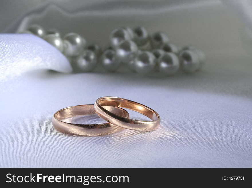 Wedding rings on a silk background