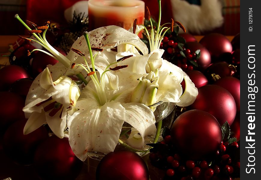 Christmas flowers surrounded by red ornaments