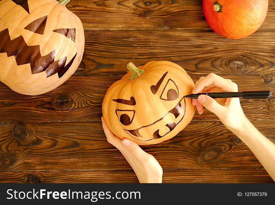 Halloween themed image with carved pumpkins in house party environment.