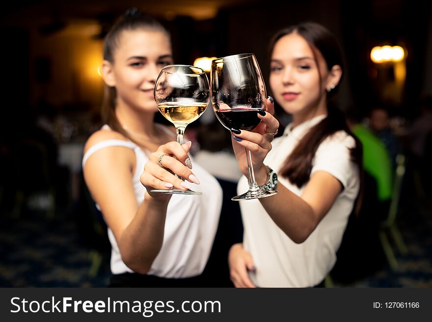 Two girls with glasses of wine