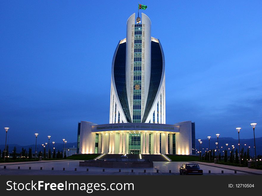 Administration building on the night sky as a background. Ashkhabad. Turkmenistan.