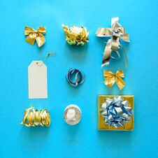 Golden And Silver Christmas Gift Boxes And Decorations On Blue Background. Flat Lay. Top View Royalty Free Stock Photo