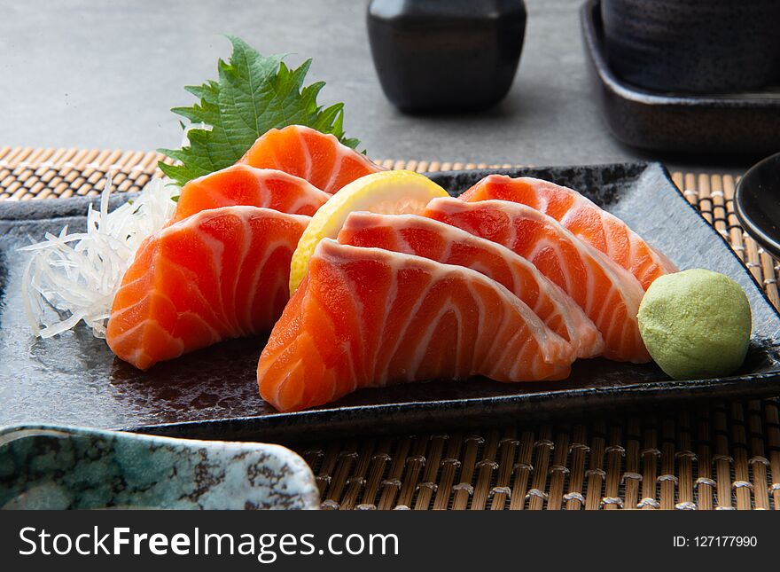 Raw fresh salmon slice or salmon sashimi in Japanese style. Raw fresh salmon slice or salmon sashimi in Japanese style