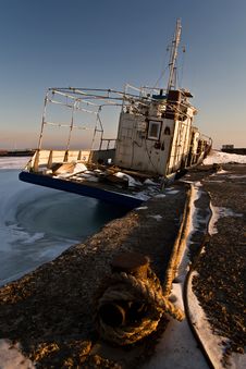 Ship In Ice At The Pier Royalty Free Stock Photo