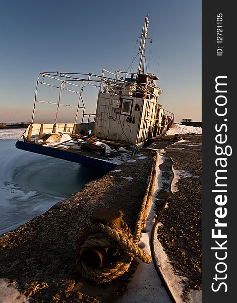 Ship stuck in ice at the pier in winter cold. Ship stuck in ice at the pier in winter cold