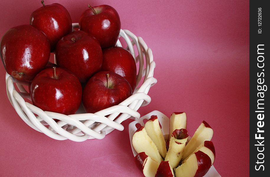 Apple in fruit basket with apple cutter