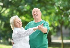 Cute Elderly Couple Dancing Outdoors. Stock Image