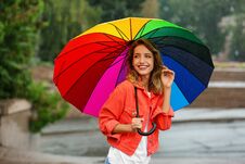 Happy Young Woman With Bright Umbrella Royalty Free Stock Photo