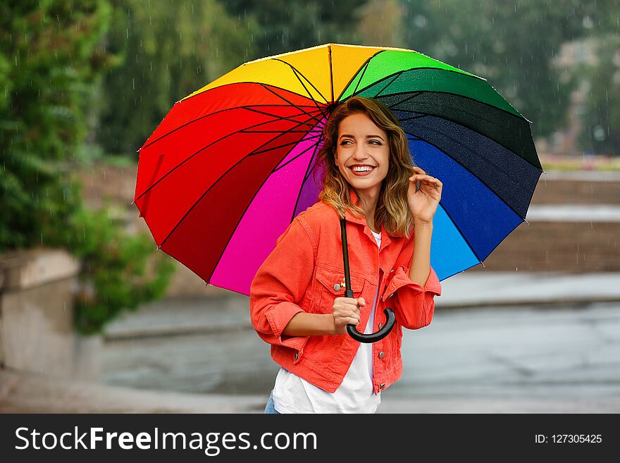 Happy Young Woman With Bright Umbrella