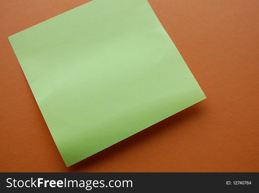 Yellow note paper with a red background. Yellow note paper with a red background