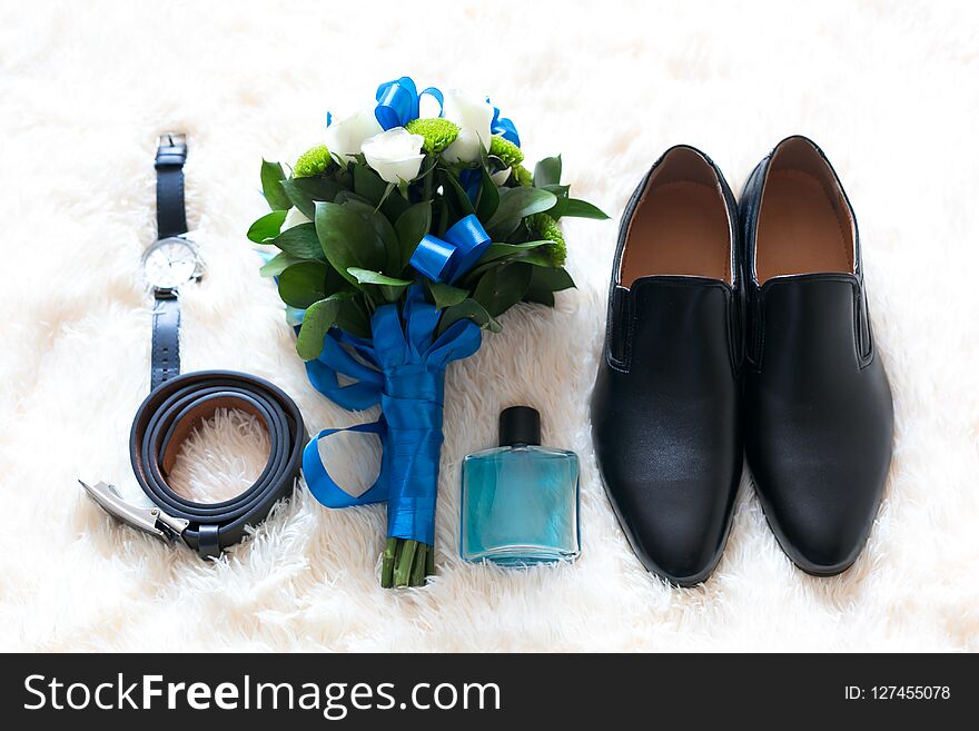 The groom`s accessories on the wedding day the shoes are a bouquet of perfume watches. The groom`s accessories on the wedding day the shoes are a bouquet of perfume watches.