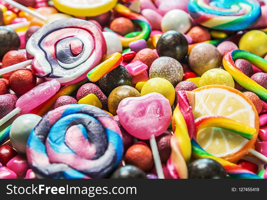 background from variety of sweets, lollipops, chewing gum, candies