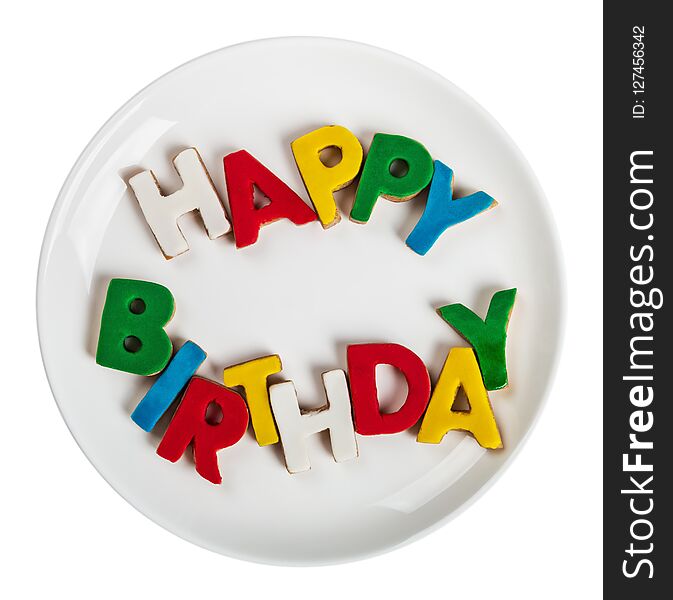 Letters with the word happy birthday from cookies with icing isolated on white background