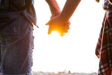 Young Couple In Love Walking In The Autumn Park Holding Hands Looking In The Sunset Royalty Free Stock Photos