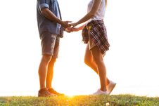 Young Couple In Love Walking In The Autumn Park Holding Hands Looking In The Sunset Stock Image