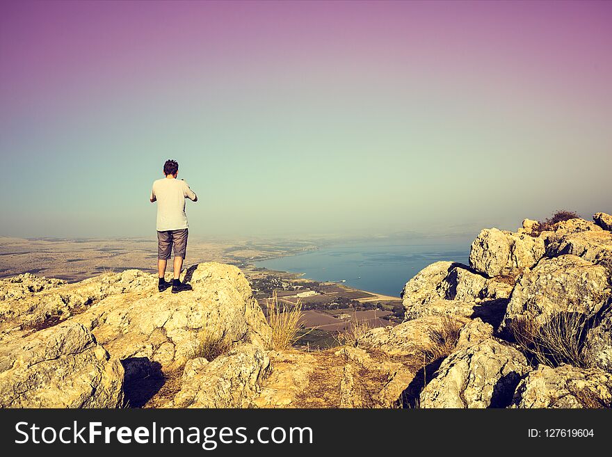 Man Standing On Arbel Cliff