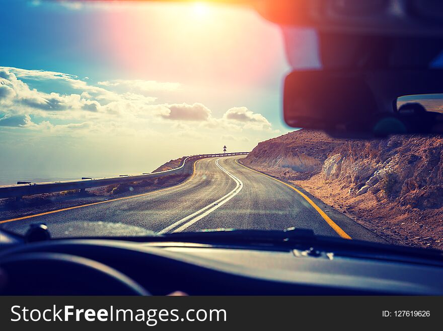 Driving A Car On A Mountain Road