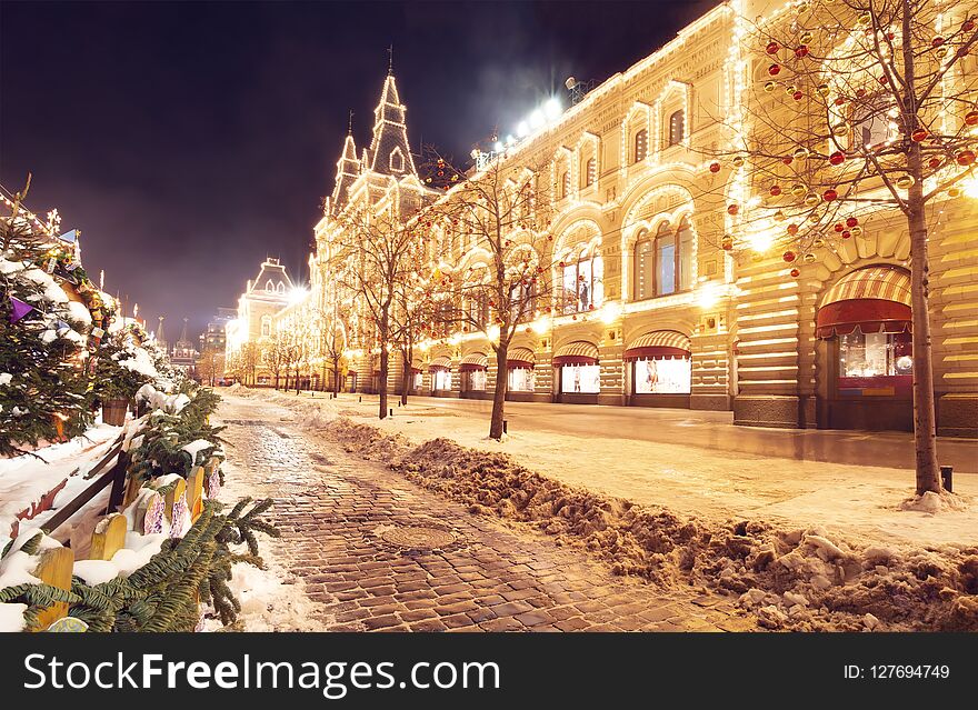 Winter Moscow at night. Festive decorations on Red Square near GUM. City is illuminated glowing and shining lights for celebration party. Beautiful Moscow in evening. Christmas and New Year time.