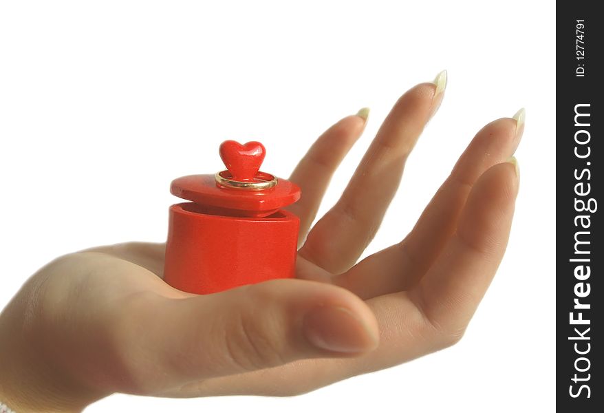 Wedding ring on the box in the form of a heart in the palm. Wedding ring on the box in the form of a heart in the palm