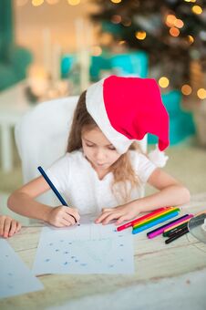 The Girl Writes A Letter To Santa For The New Year. Stock Photography
