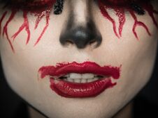 Makeup For Halloween. Scary Lips In The Blood And Crooked Teeth. Royalty Free Stock Photography