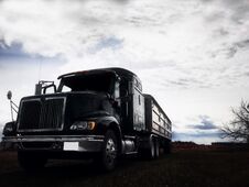 Looming Grain Truck And Trailer Royalty Free Stock Photography