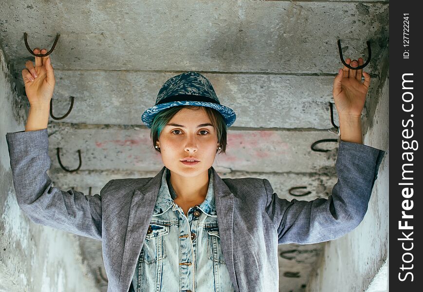 Portrait Of A Young Woman In A Hat And Jacket. Street Style.