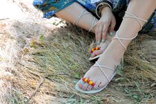 Handcrafted Sandals On A Woman Legs, Close Up, Blue Pedicures, Indie Style Royalty Free Stock Photos