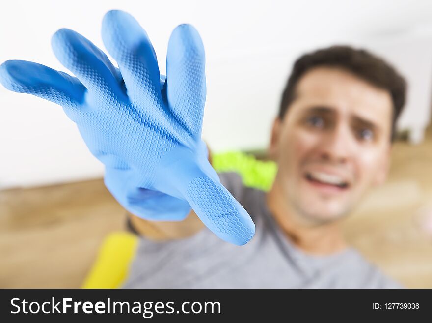 Frustrated Young Man Holding Cleaning Equipment. Cleaning Time