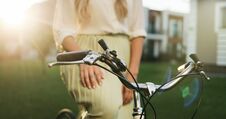Close Up Hands Of A Young Girl On Vintage Bicycle In Park. Royalty Free Stock Image