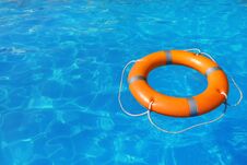 Lifebuoy Floating In Swimming Pool On Sunny Day Stock Image
