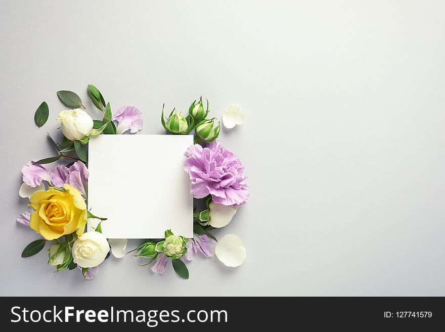 Flat lay composition with beautiful blooming flowers