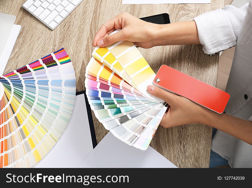 Woman With Color Palette Samples At Table