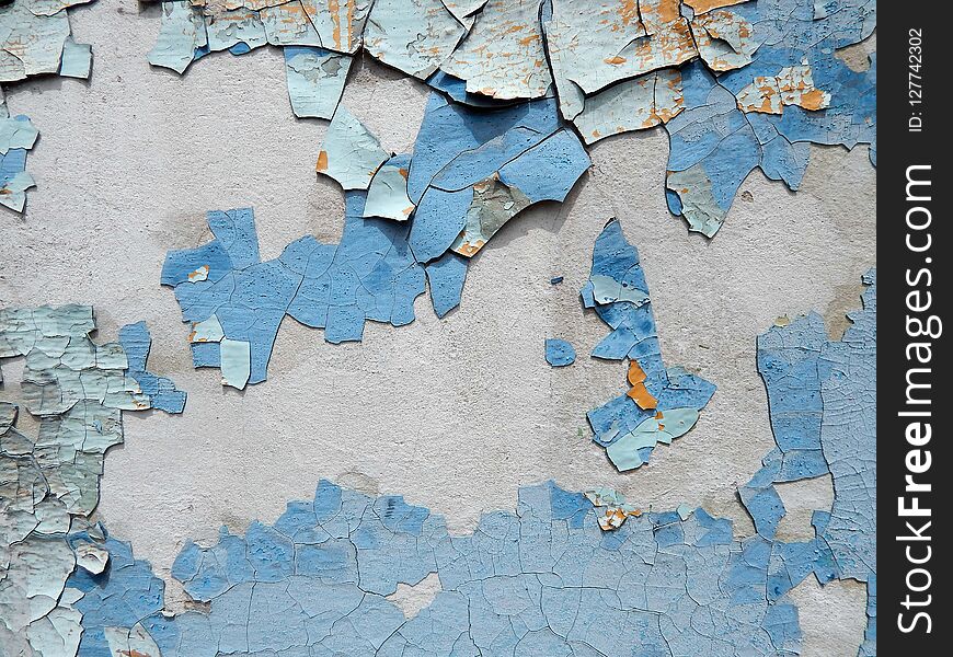 Old wall stucco with scratches and cracks. Textured background