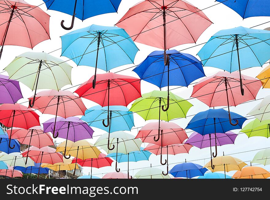 Many opened multicolored umbrellas