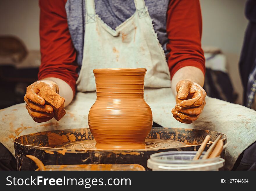 Potter at work. makes a jug out of clay. Potter at work. makes a jug out of clay