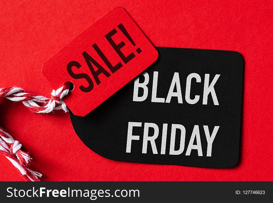 Black Friday Sale text on a red and black tag. Shopping concept.